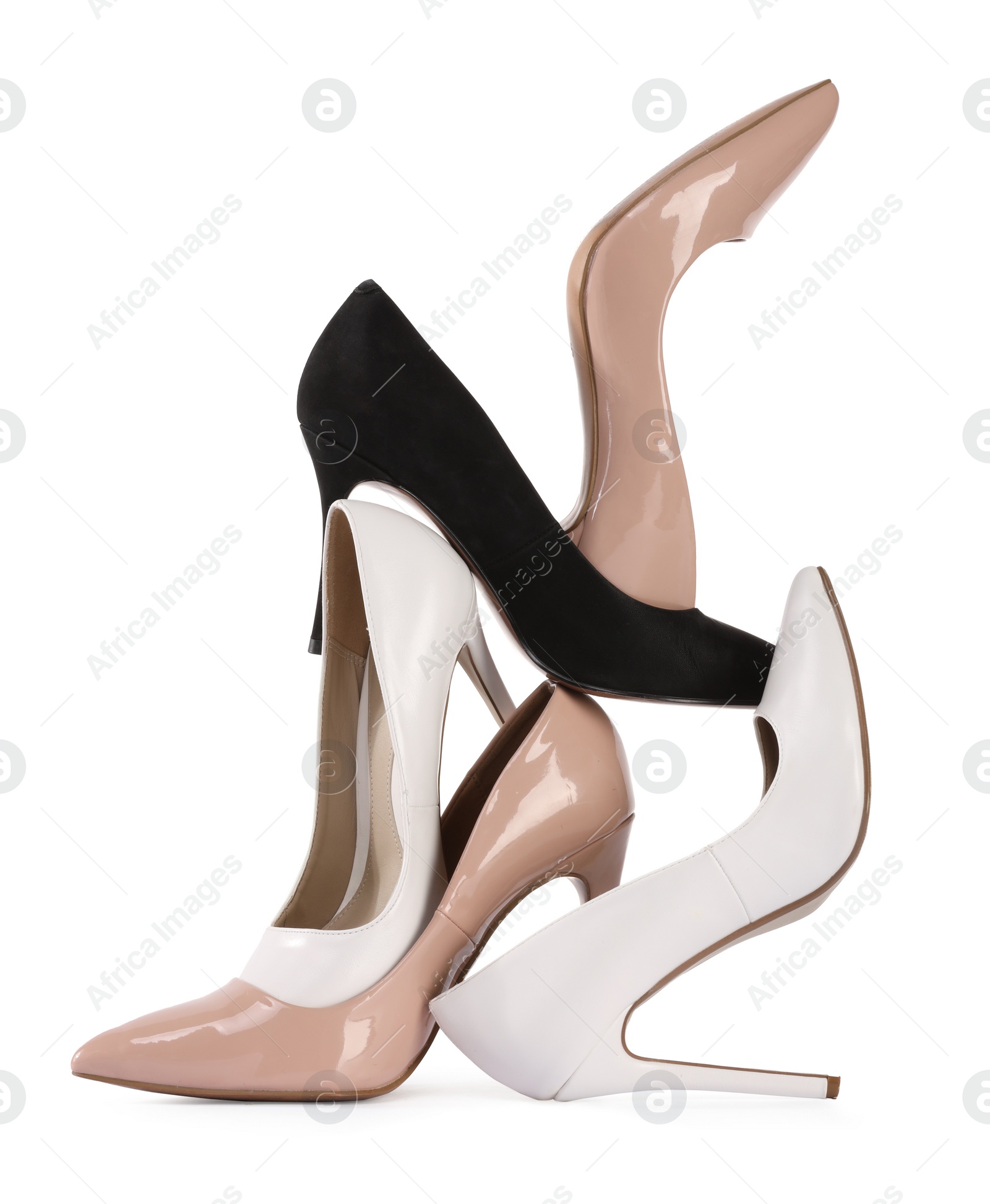 Photo of Pile of different high heels isolated on white