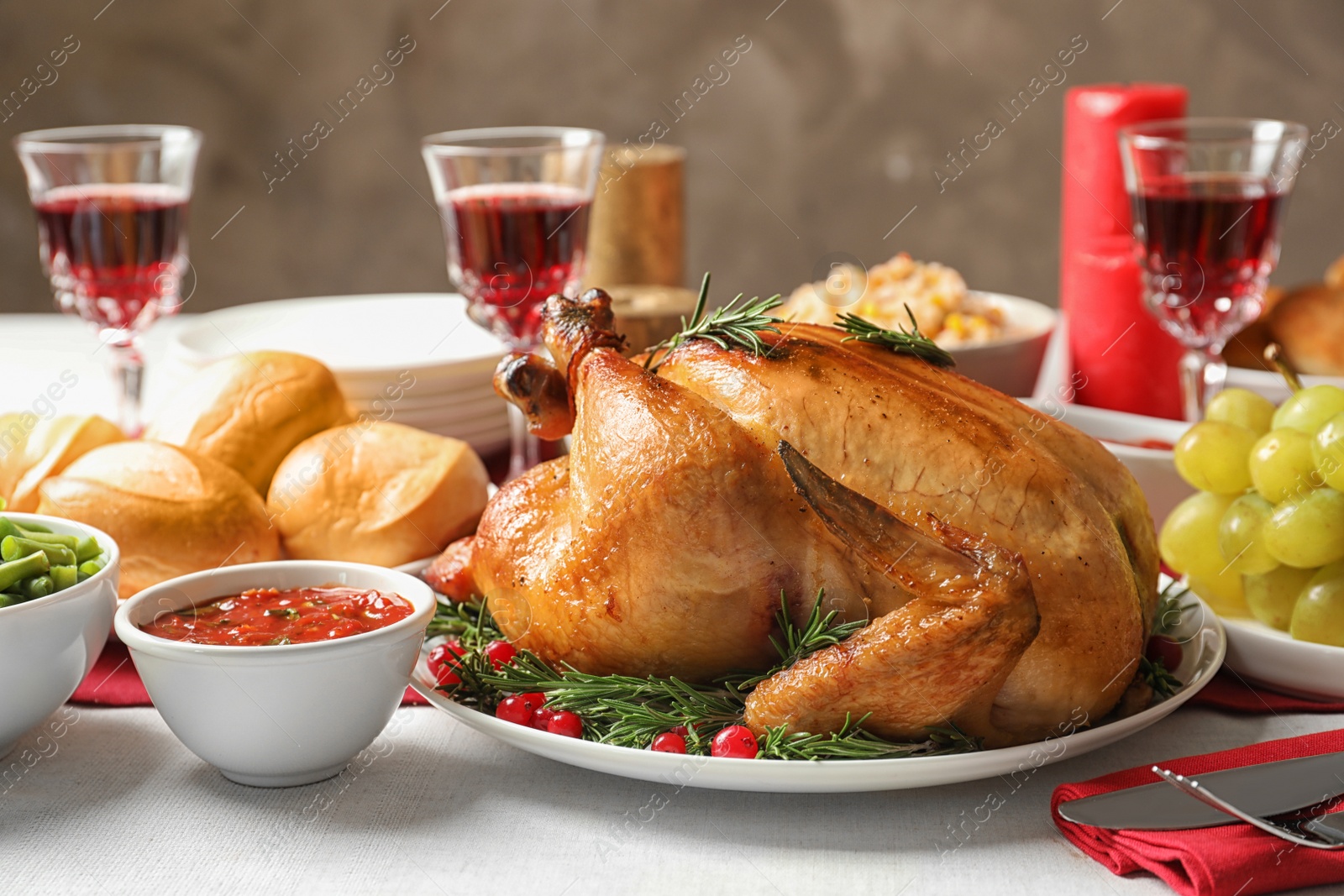 Photo of Traditional festive dinner with delicious roasted turkey served on table