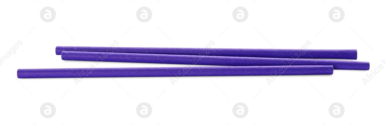 Photo of Purple paper cocktail straws on white background