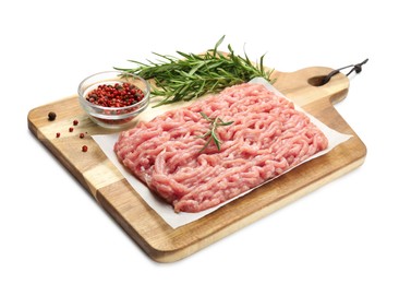 Raw chicken minced meat with spices and rosemary on white background