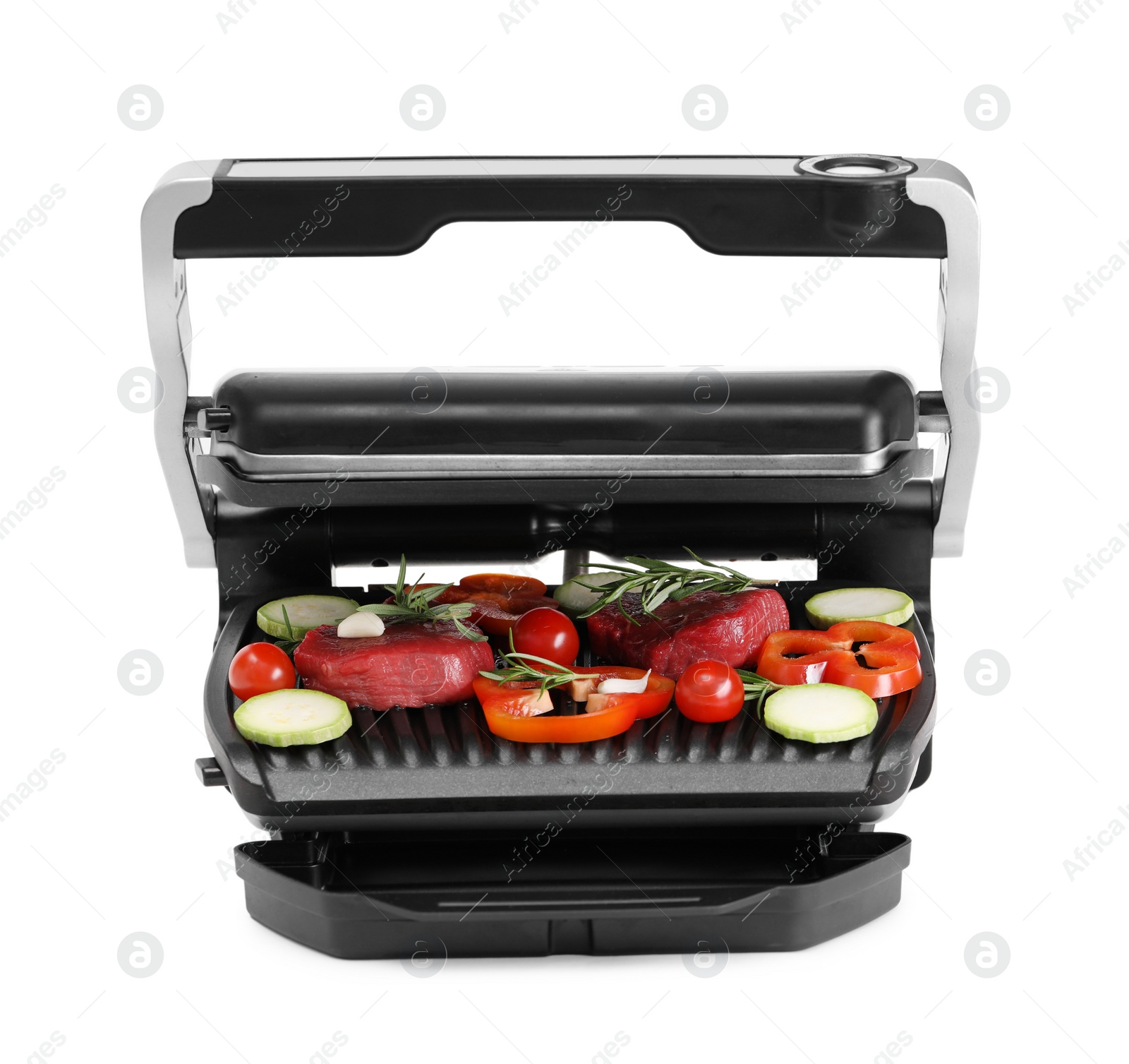 Photo of Electric grill with raw meat, rosemary and vegetables isolated on white