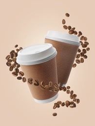 Image of Coffee to go. Paper cups and roasted beans flying on beige background