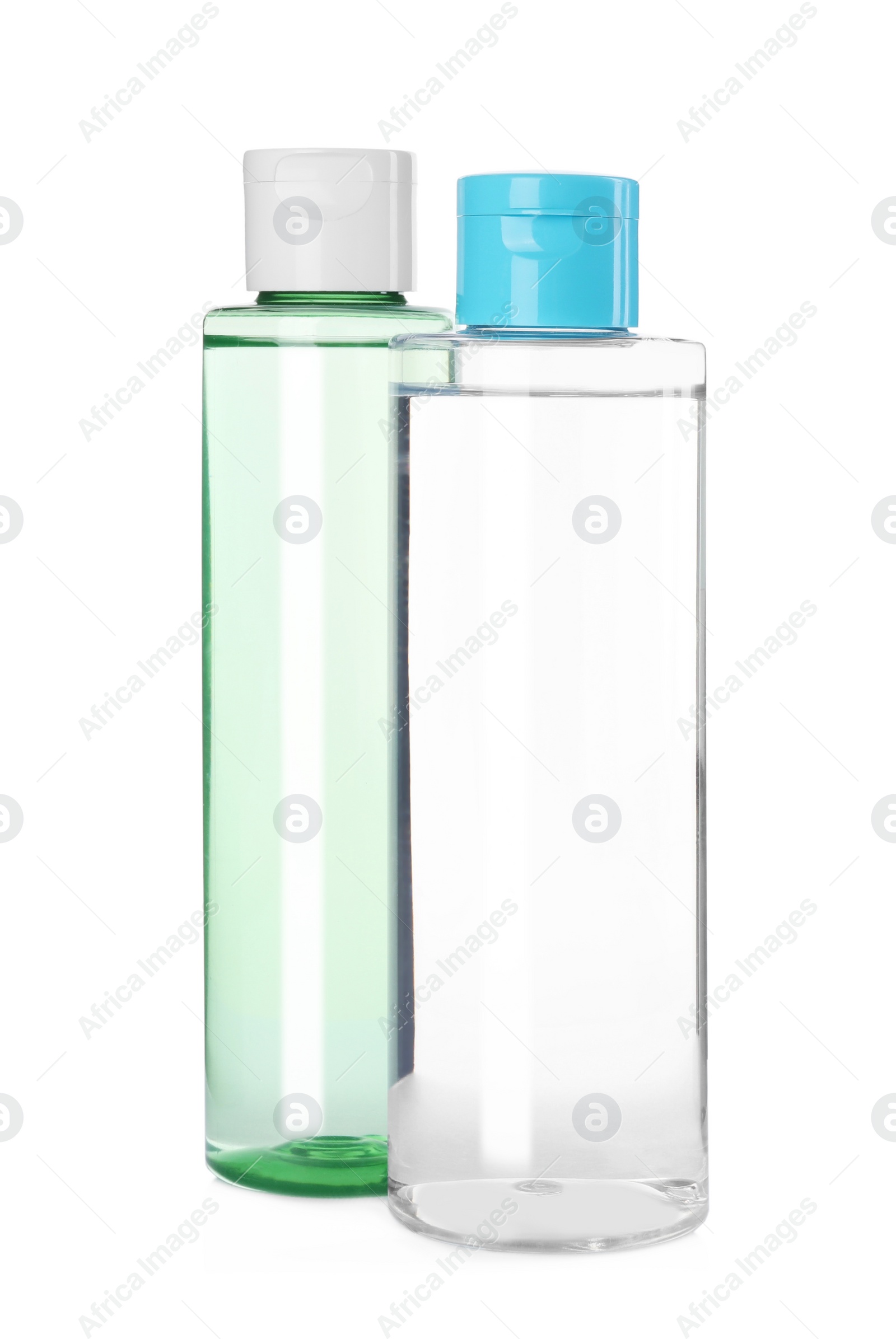 Photo of Bottles of micellar cleansing water on white background