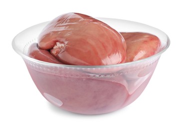 Photo of Bowl with fresh raw pork kidneys on white background