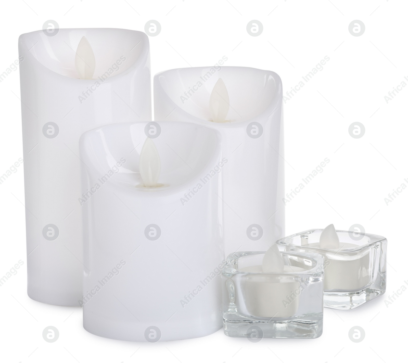 Photo of Different decorative flameless LED candles on white background