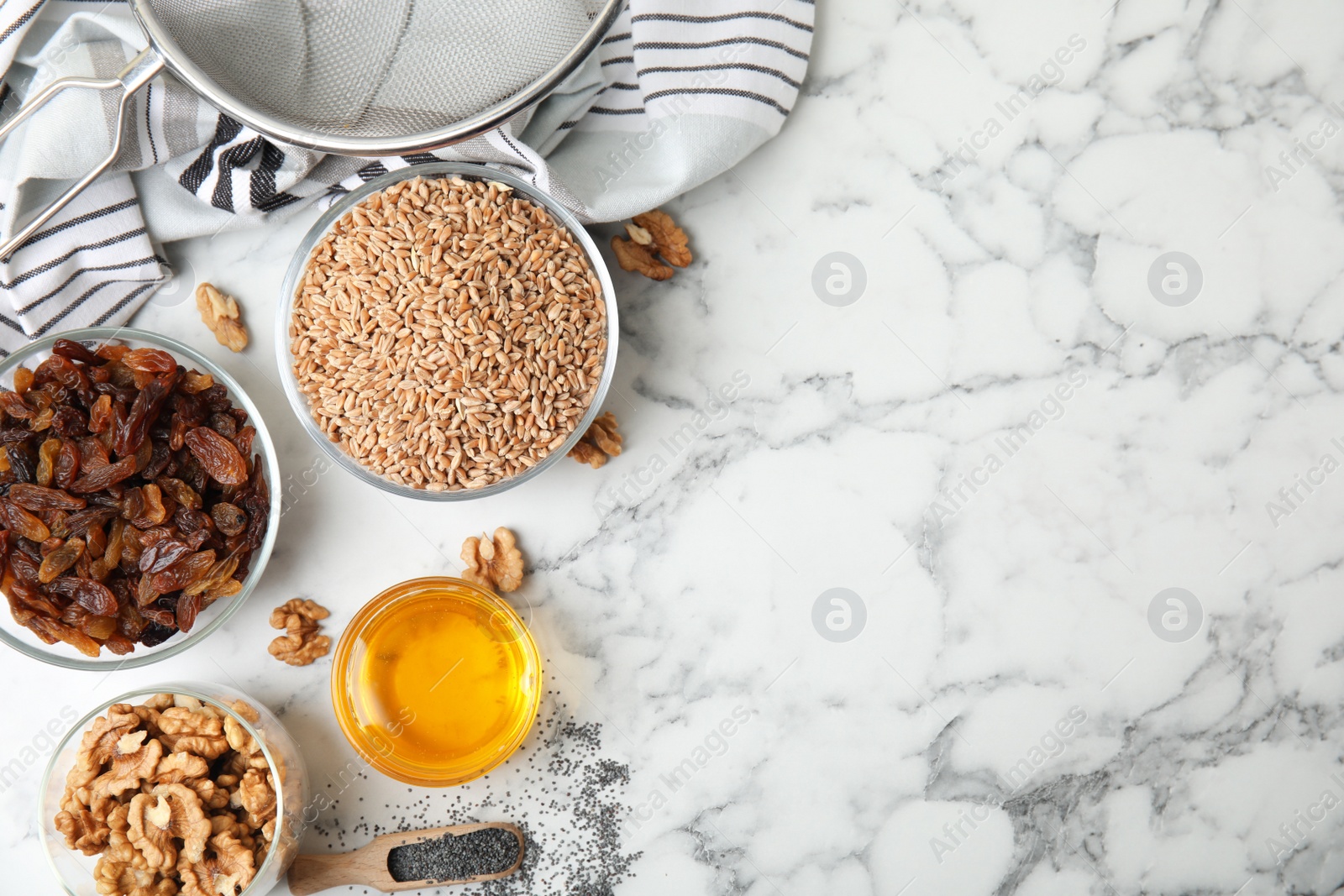 Photo of Ingredients for traditional kutia on white marble table, flat lay. Space for text