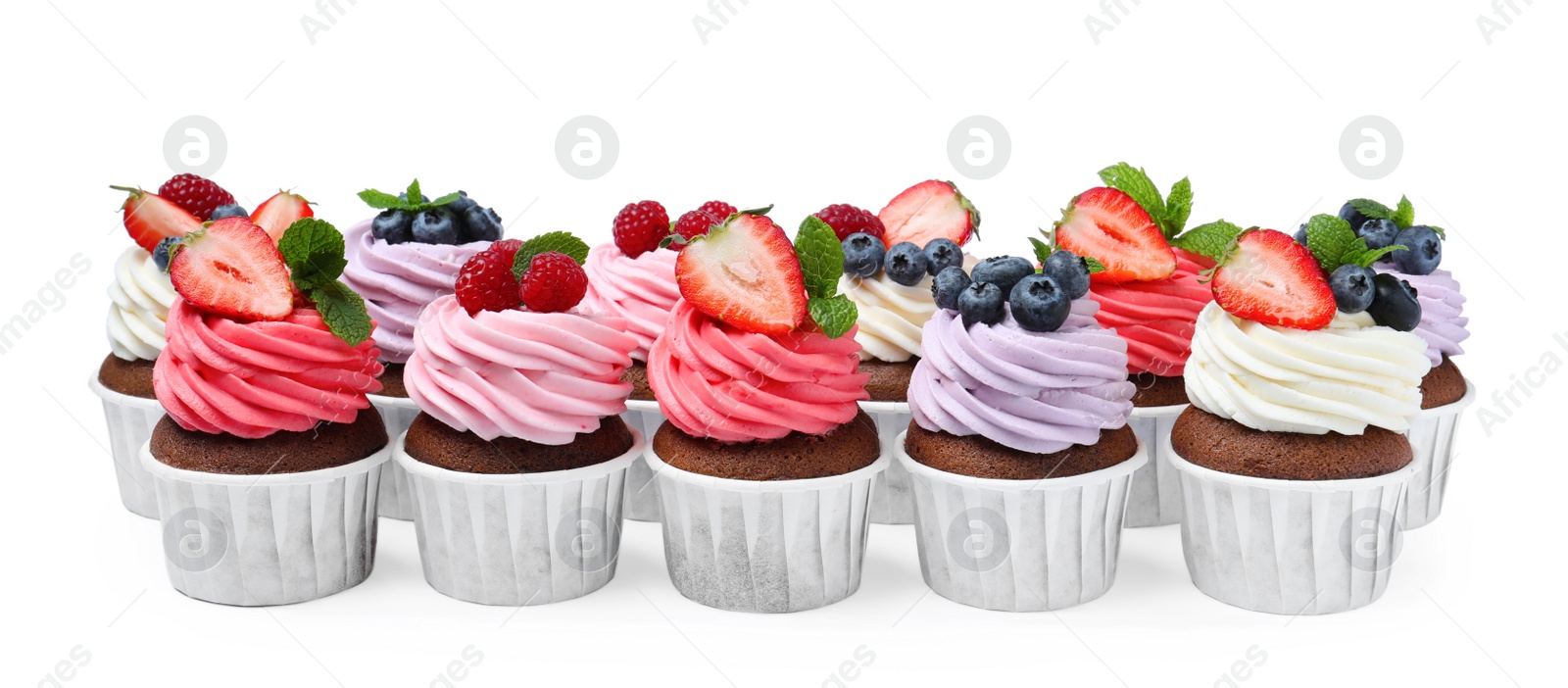 Photo of Sweet cupcakes with fresh berries on white background