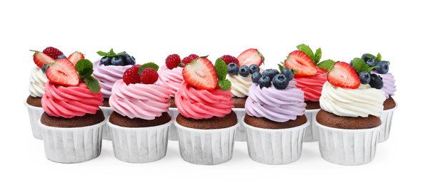 Photo of Sweet cupcakes with fresh berries on white background