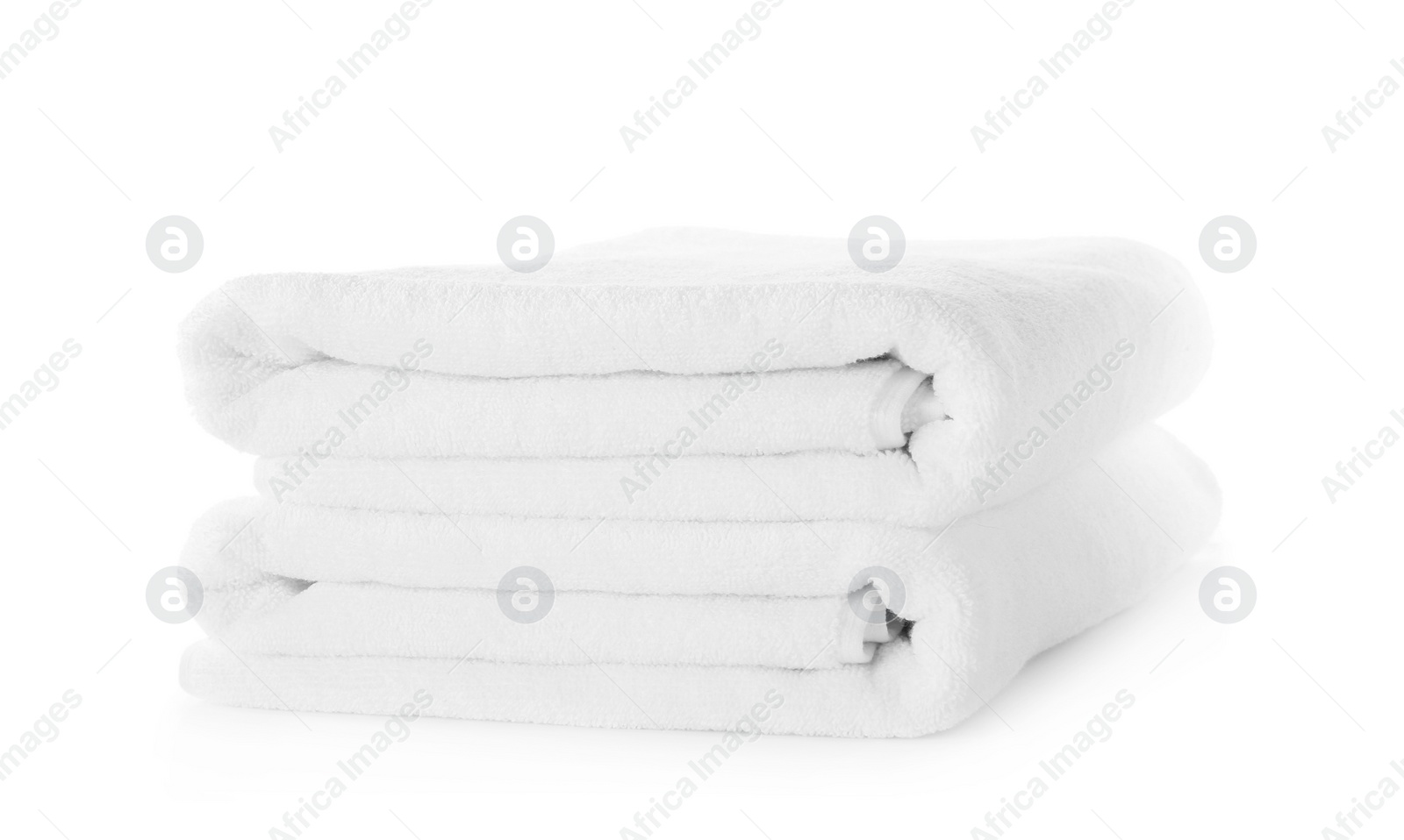 Photo of Folded fresh clean towels isolated on white