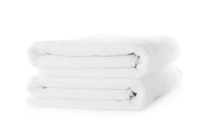 Photo of Folded fresh clean towels isolated on white