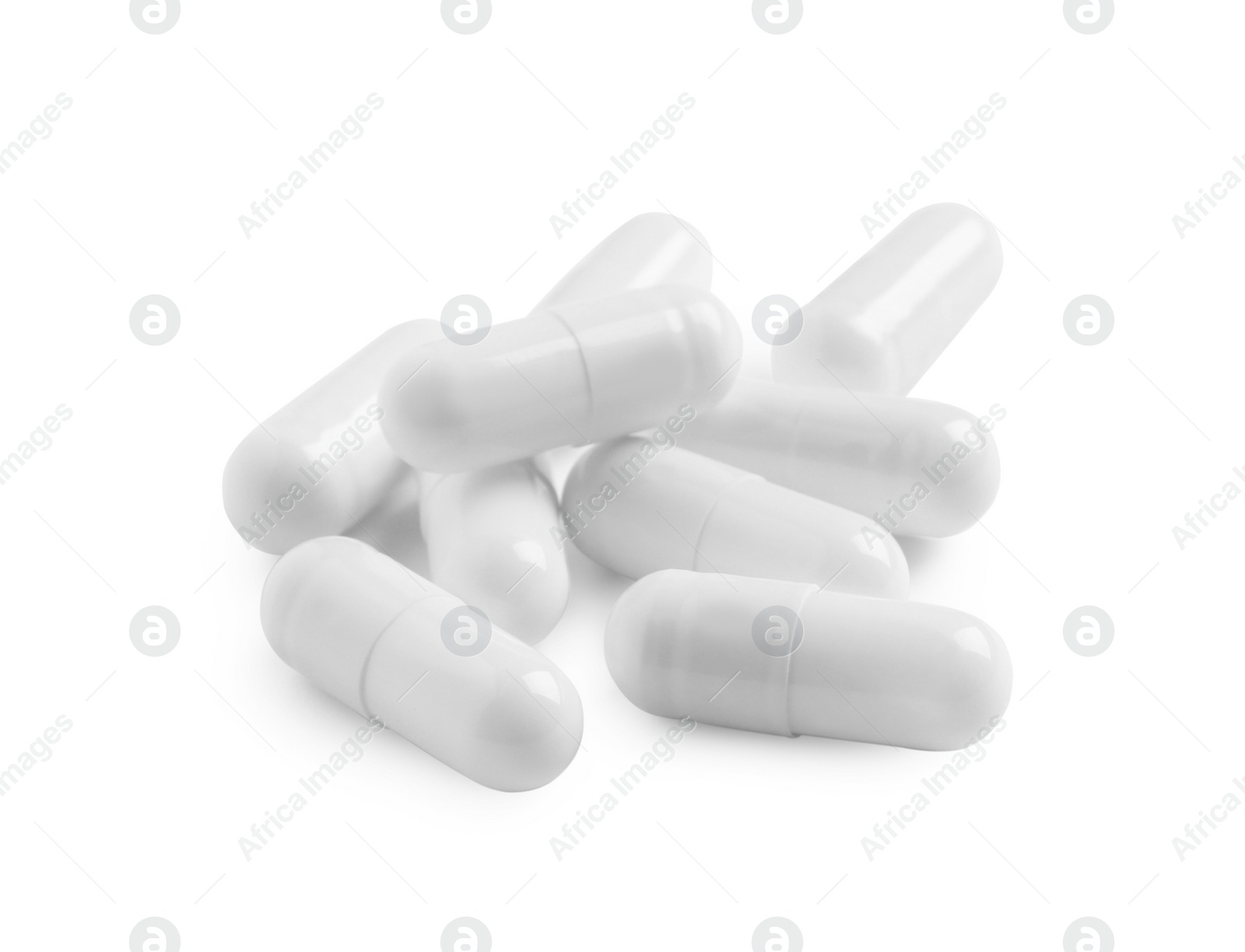 Photo of Many pills isolated on white. Medicinal treatment