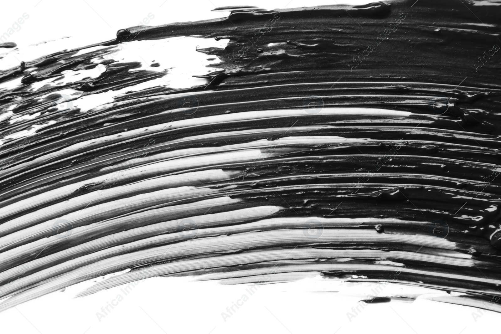 Photo of Smear of black mascara isolated on white, top view