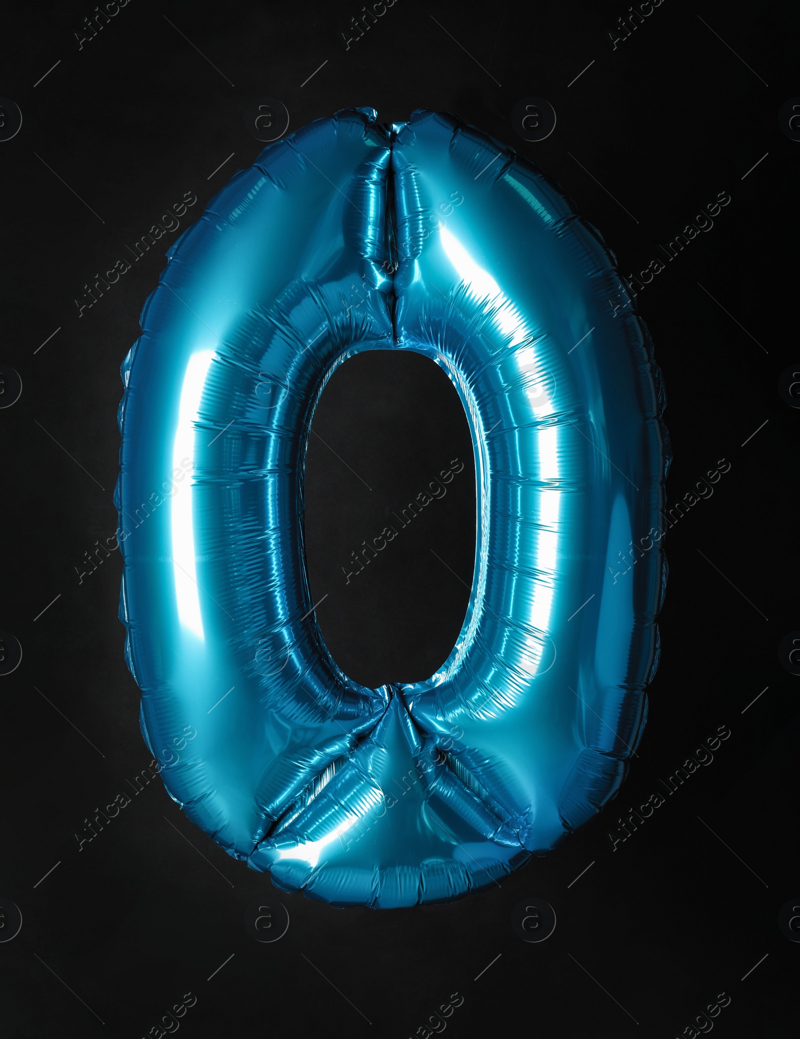 Photo of Blue number zero balloon on black background