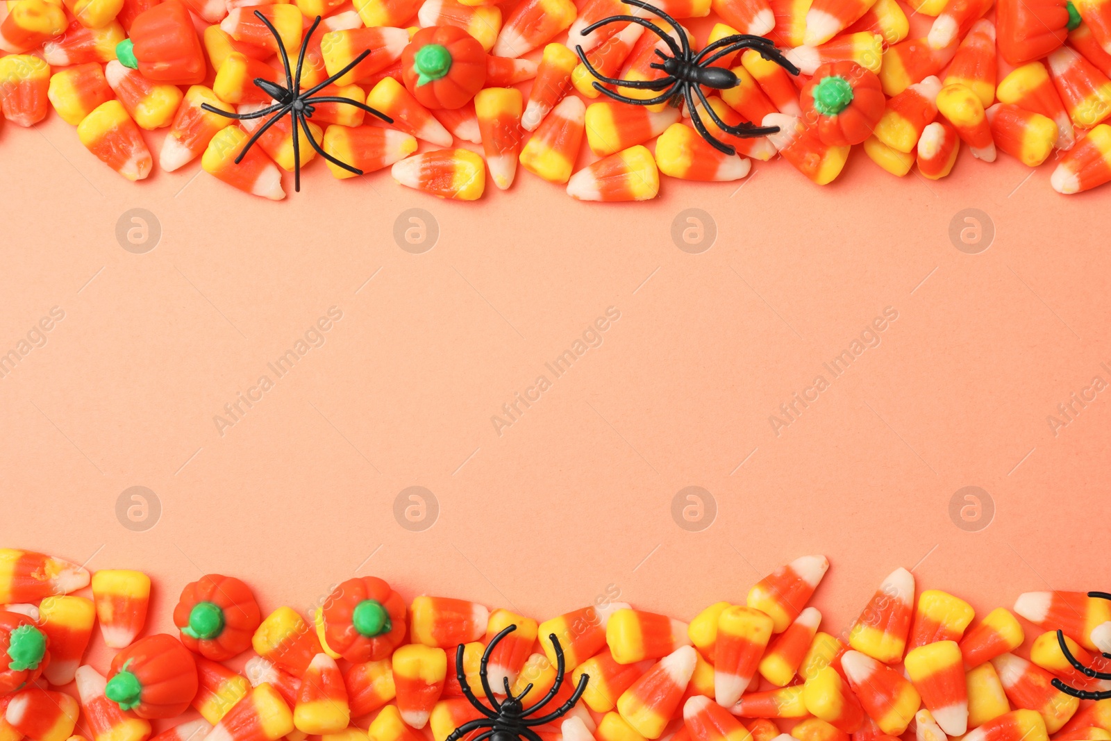 Photo of Flat lay composition with delicious candies and space for text on color background
