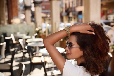 Photo of Portrait of beautiful young woman outdoors on sunny day