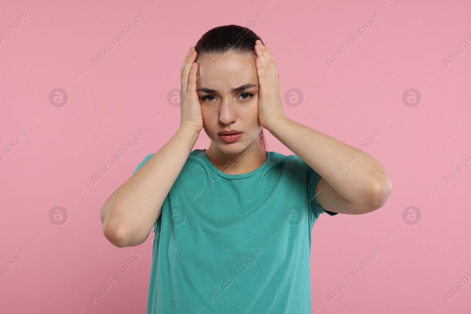 Photo of Resentment. Portrait of upset woman on pink background