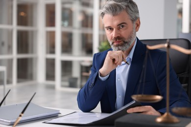 Photo of Portrait of serious lawyer man in office, space for text