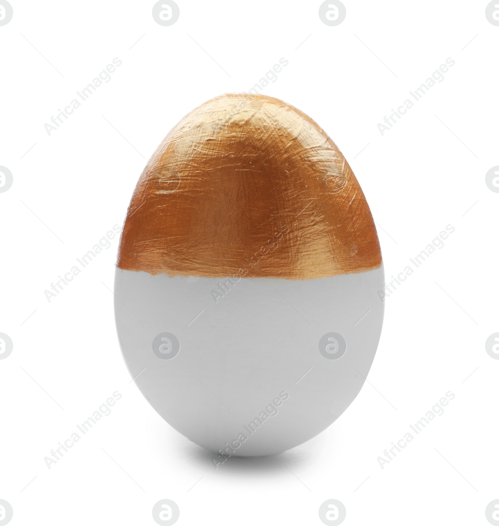 Photo of Traditional Easter egg decorated with golden paint on white background