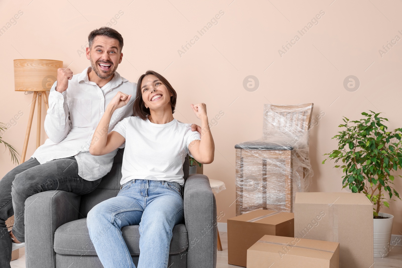 Photo of Happy couple in new apartment. Moving day