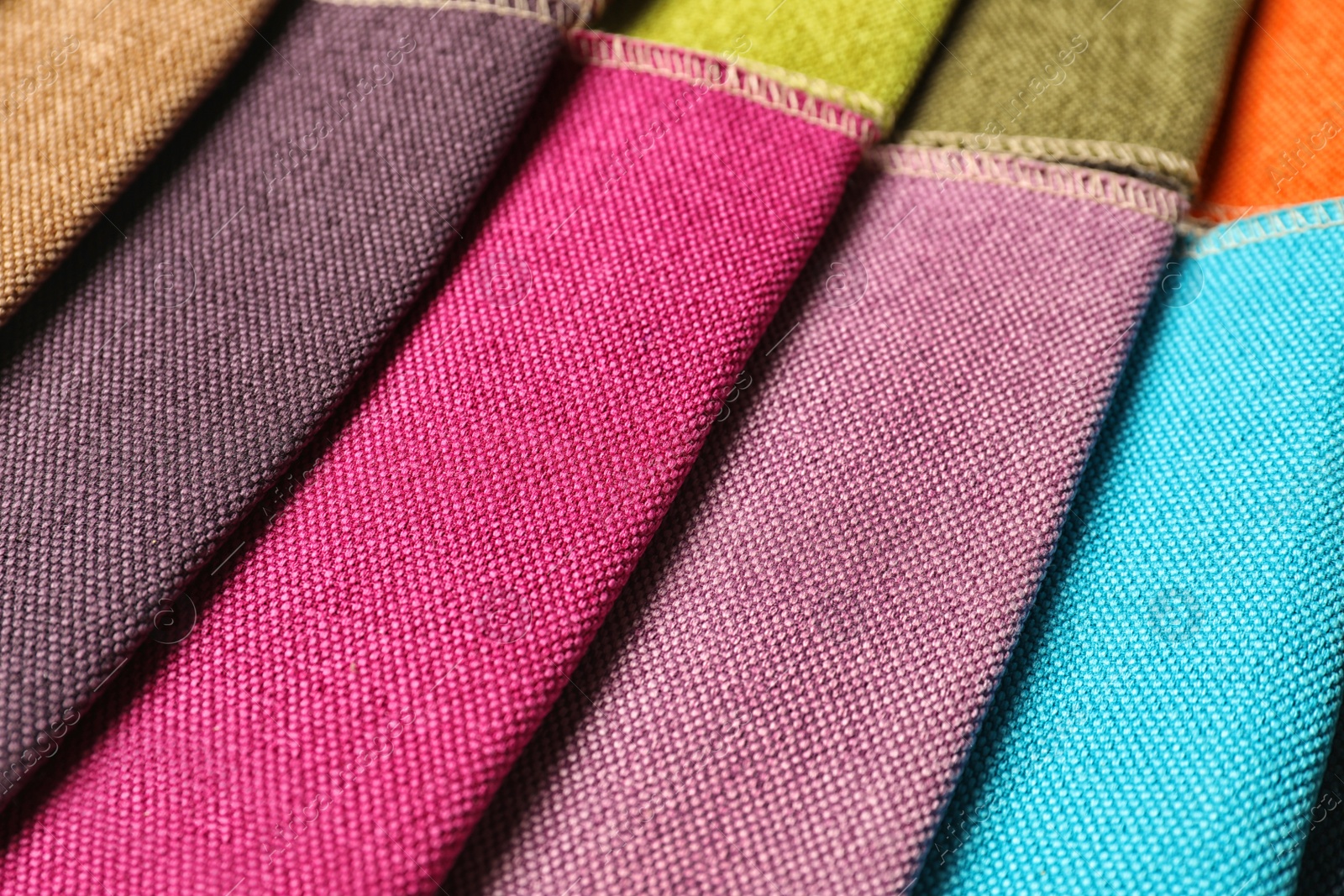 Photo of Fabric samples of different colors for interior design as background