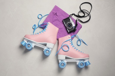 Photo of Flat lay composition with quad roller skates on light background