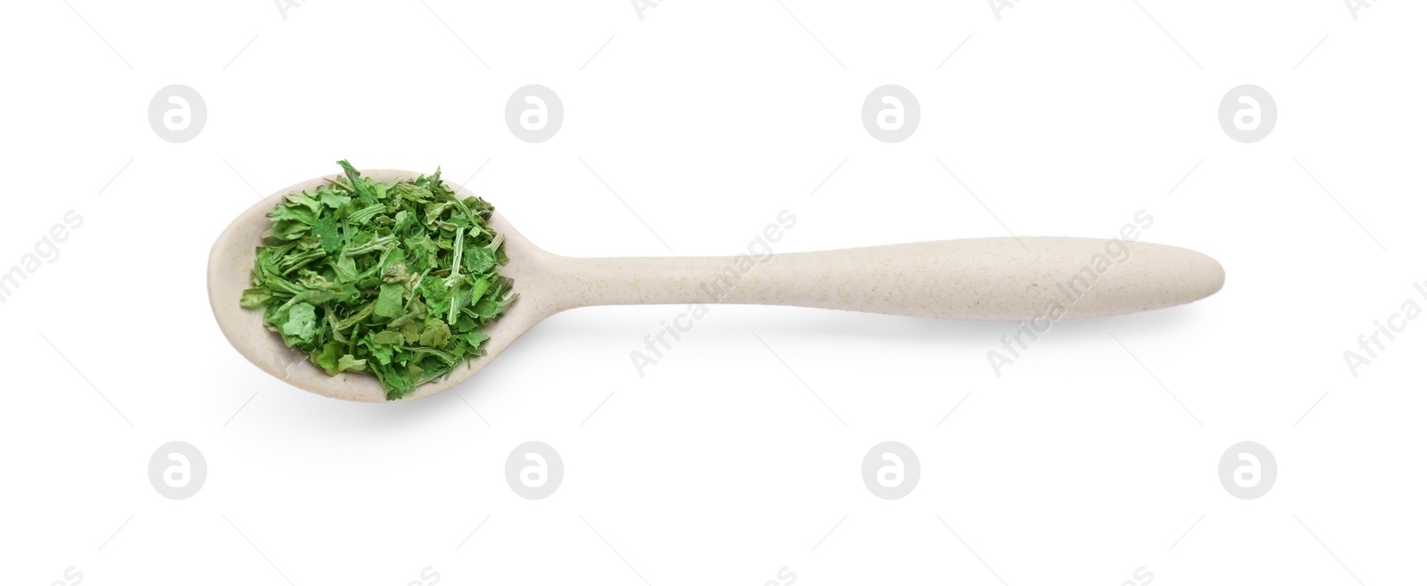 Photo of Spoon of dried parsley isolated on white, top view