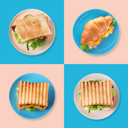 Set of yummy sandwiches and croissant on color background, top view