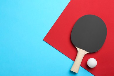 Photo of Ping pong racket and ball on color background, flat lay. Space for text