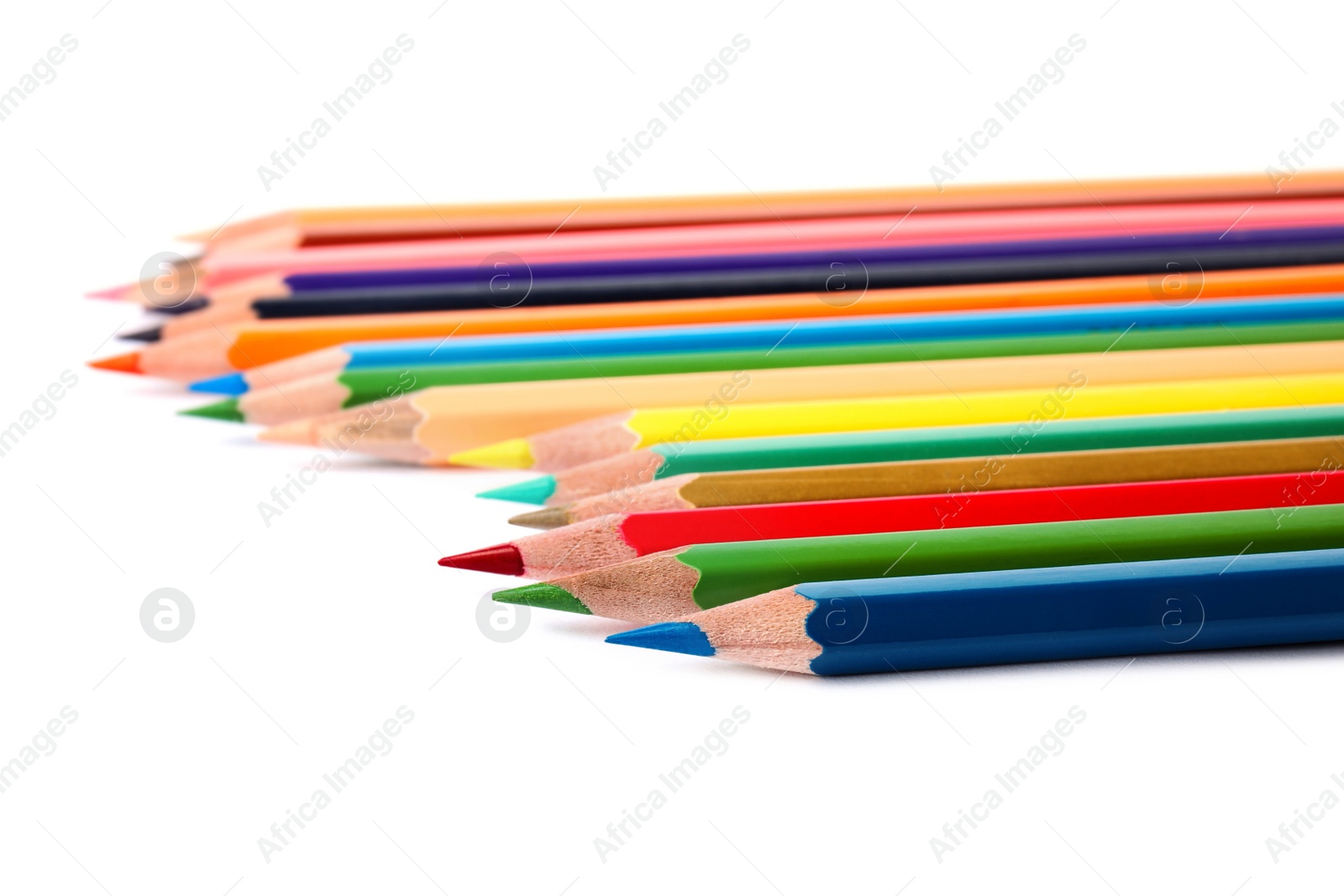 Photo of Different color pencils on white background. School stationery