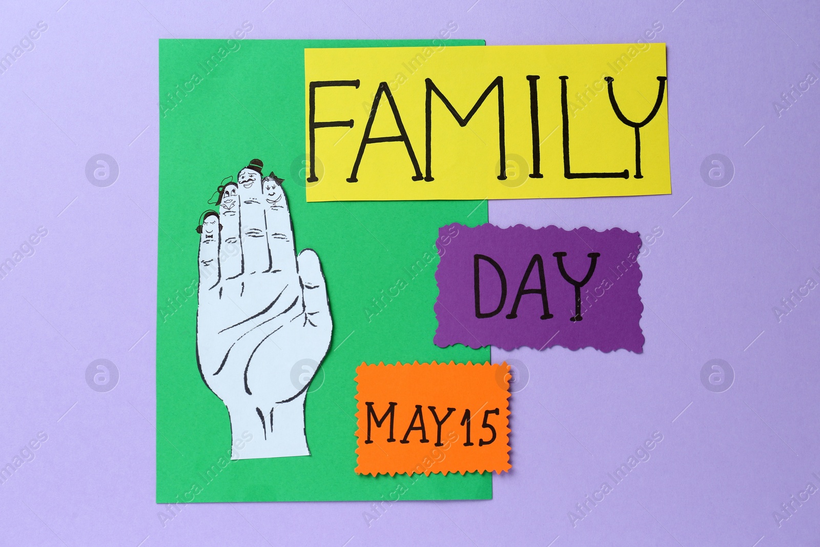 Photo of Happy Family Day. Cards with text and paper hand cutout on violet background, flat lay