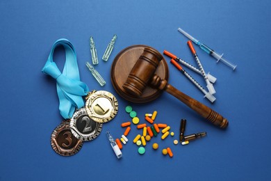 Photo of Flat lay composition with drugs on blue background. Doping control