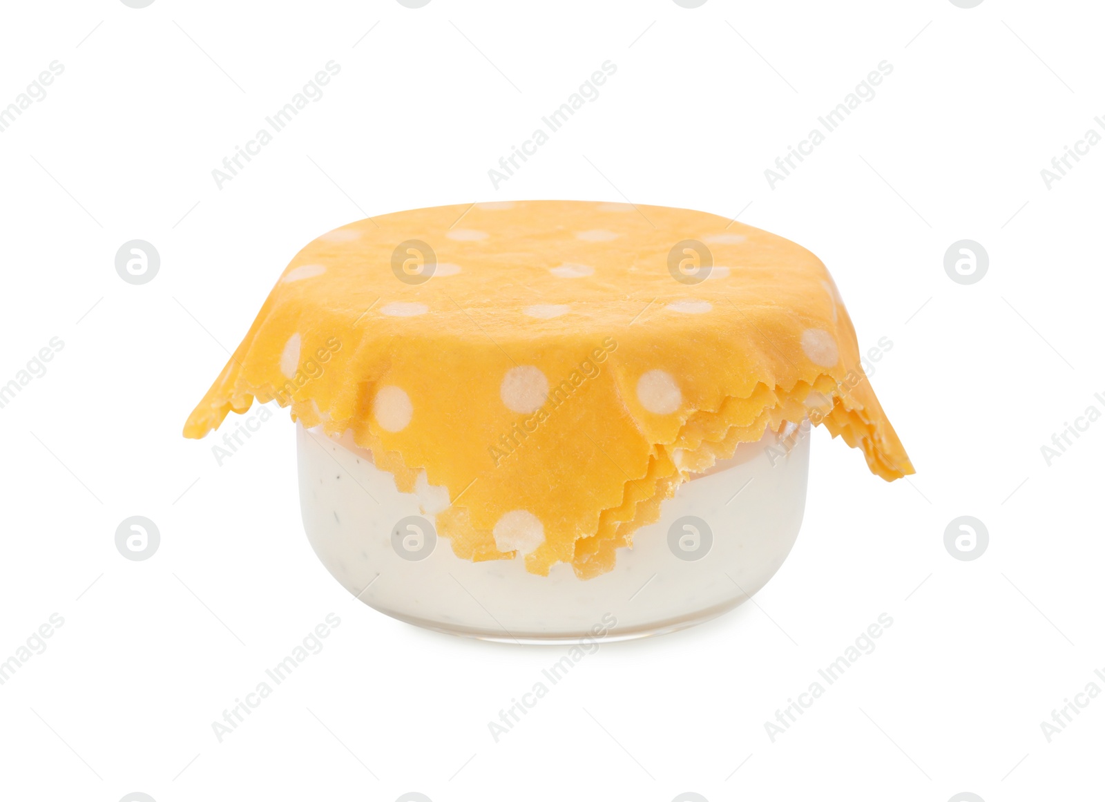 Photo of Jar of sauce covered with beeswax food wrap isolated on white