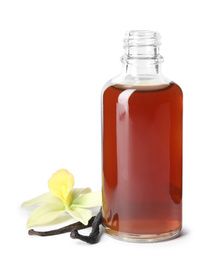 Photo of Vanilla extract, flower and dry pods isolated on white