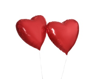 Red heart shaped balloons isolated on white. Valentine's Day celebration