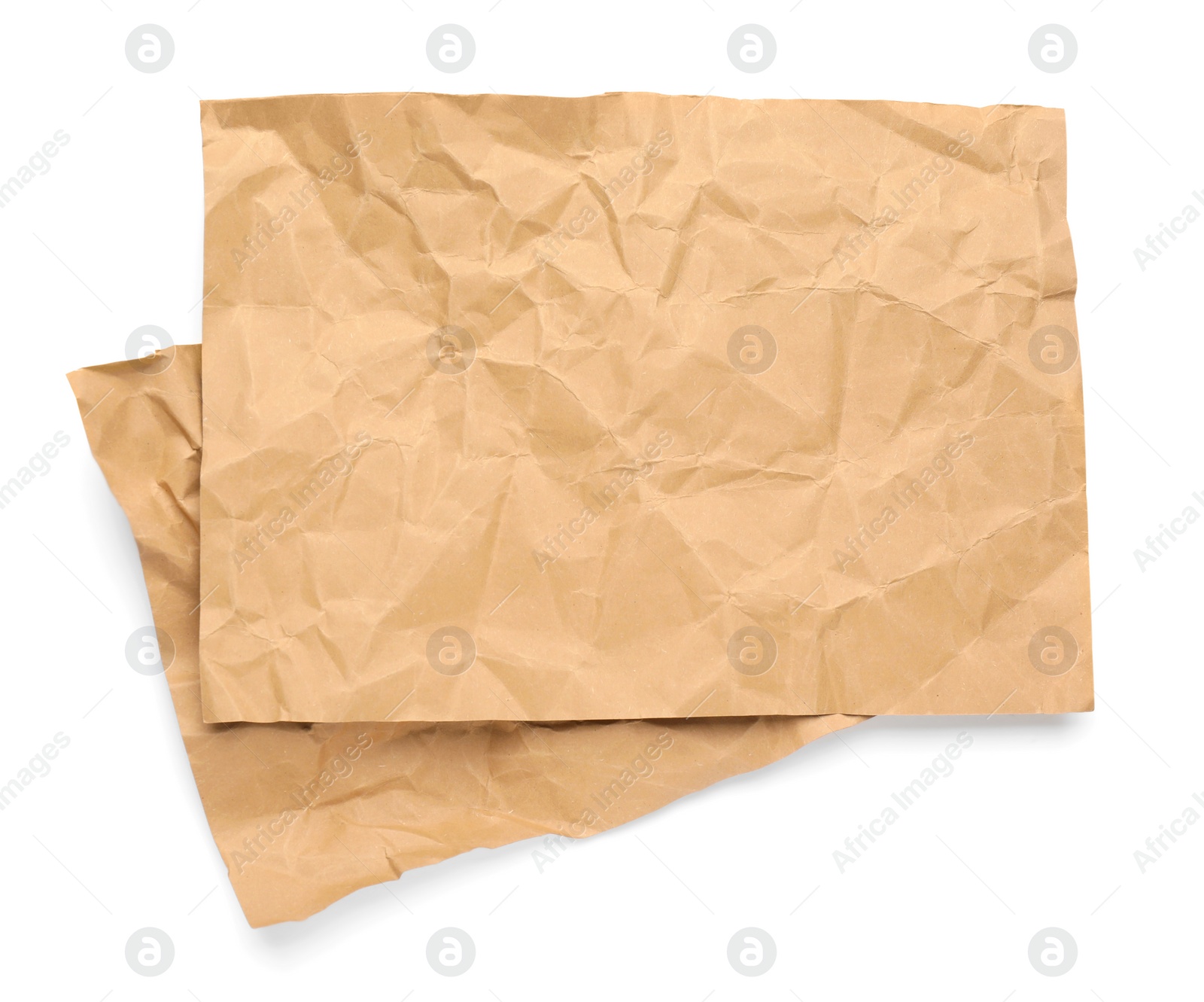 Photo of Sheets of crumpled brown paper on white background, top view