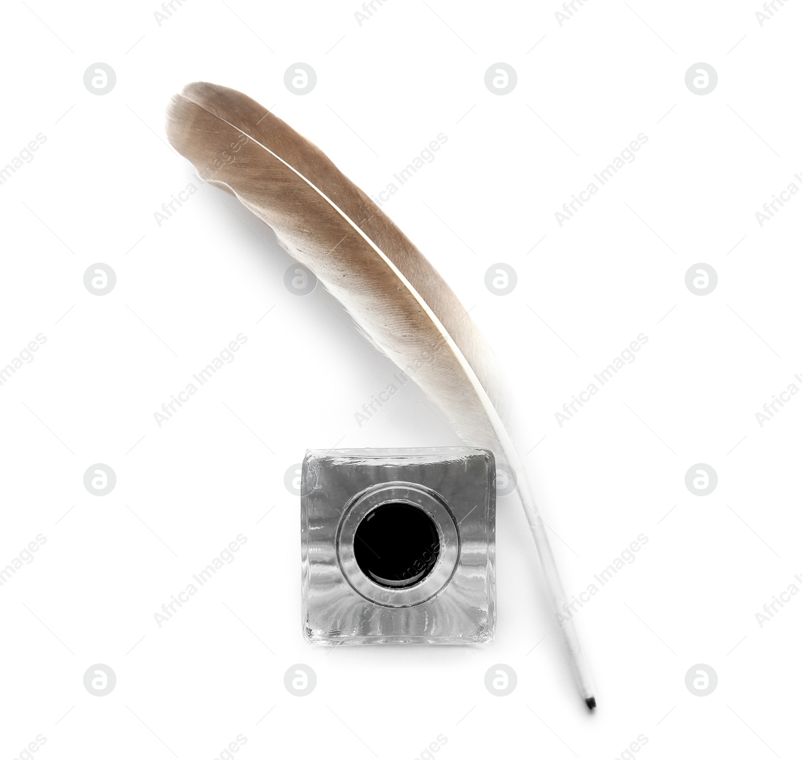 Photo of Feather pen and inkwell on white background, top view