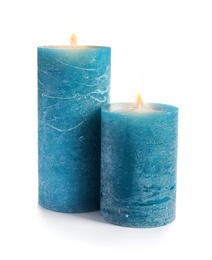 Two decorative blue wax candles on white background