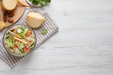 Photo of Delicious turnip salad served on white wooden table, flat lay. Space for text