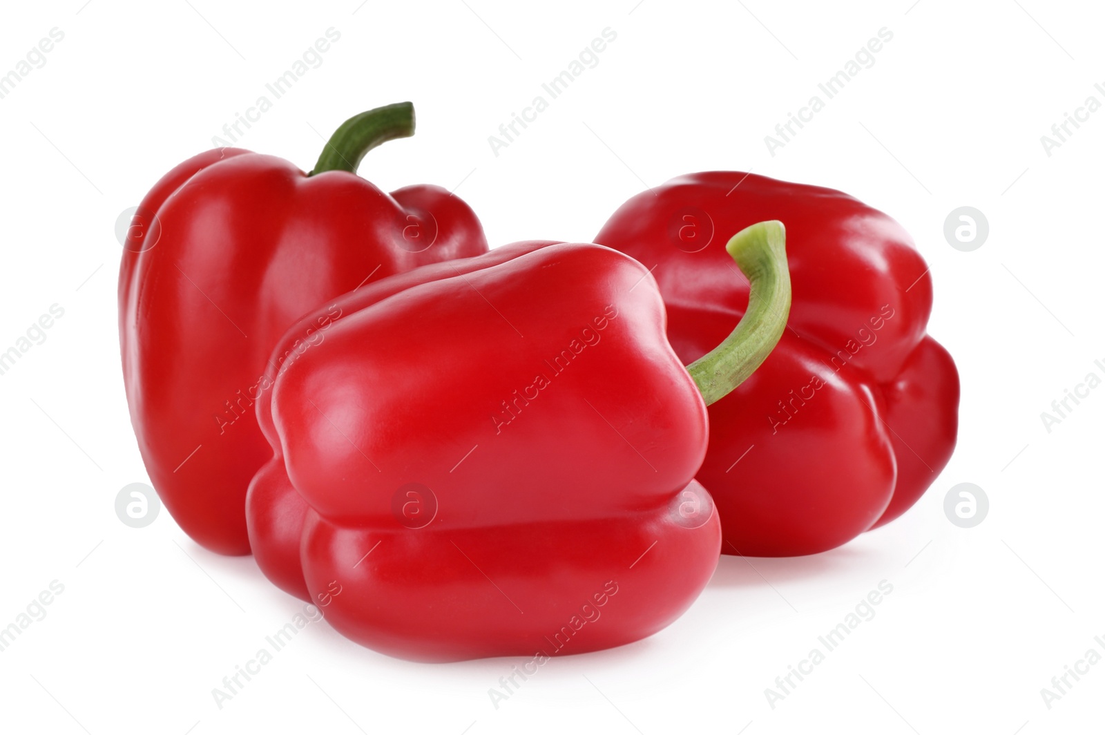 Photo of Ripe red bell peppers isolated on white