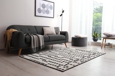Living room interior with comfortable sofa and stylish rug