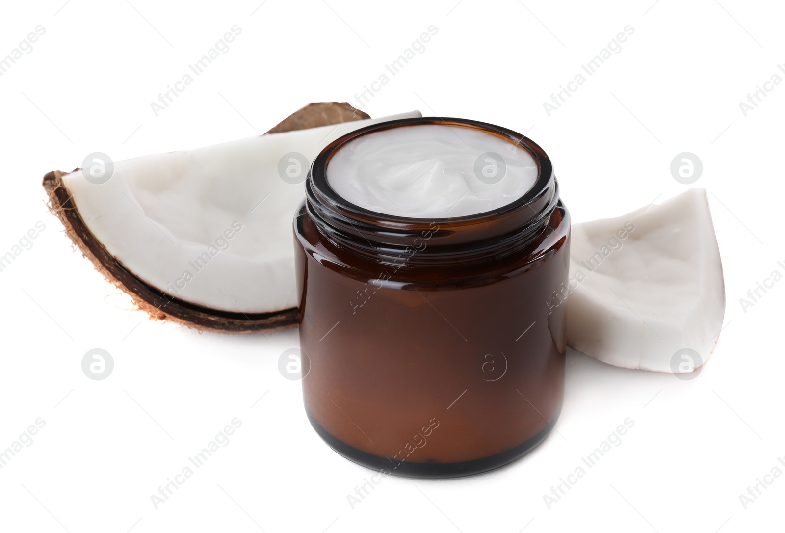 Photo of Jar of hand cream and coconut pieces on white background