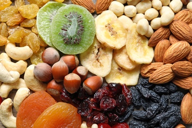 Photo of Different dried fruits and nuts as background, closeup