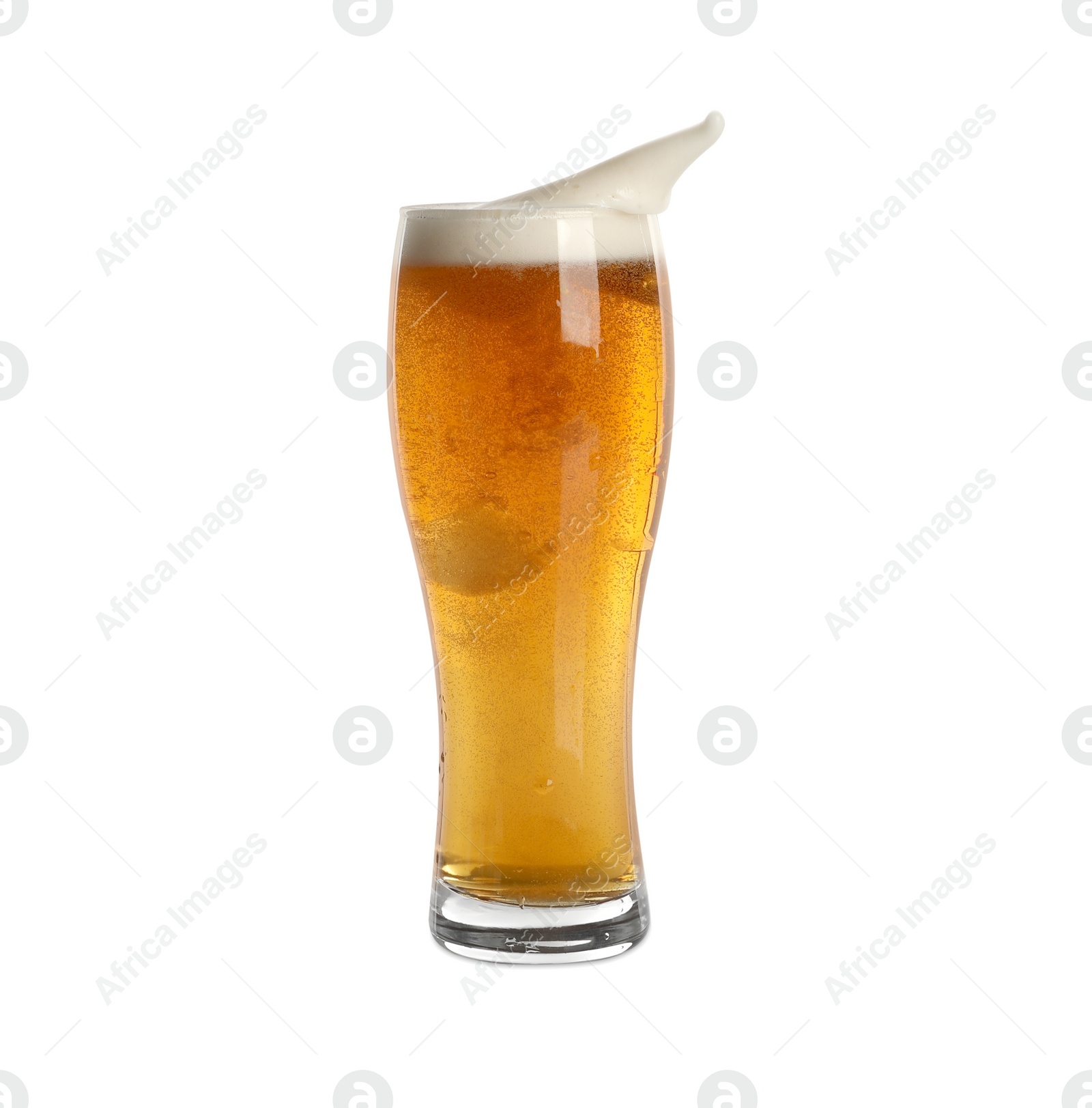 Photo of Beer splashing out of glass on white background