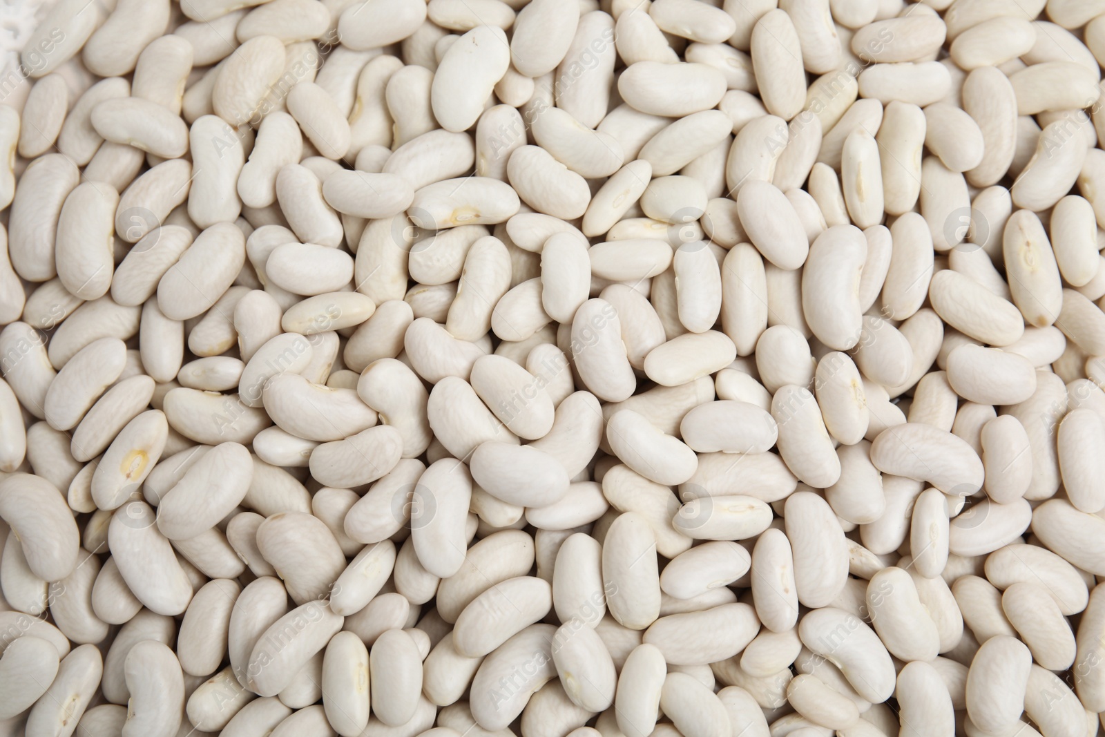 Photo of Heap of raw beans as background, top view. Veggie seeds