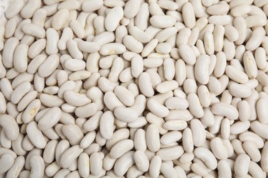 Photo of Heap of raw beans as background, top view. Veggie seeds