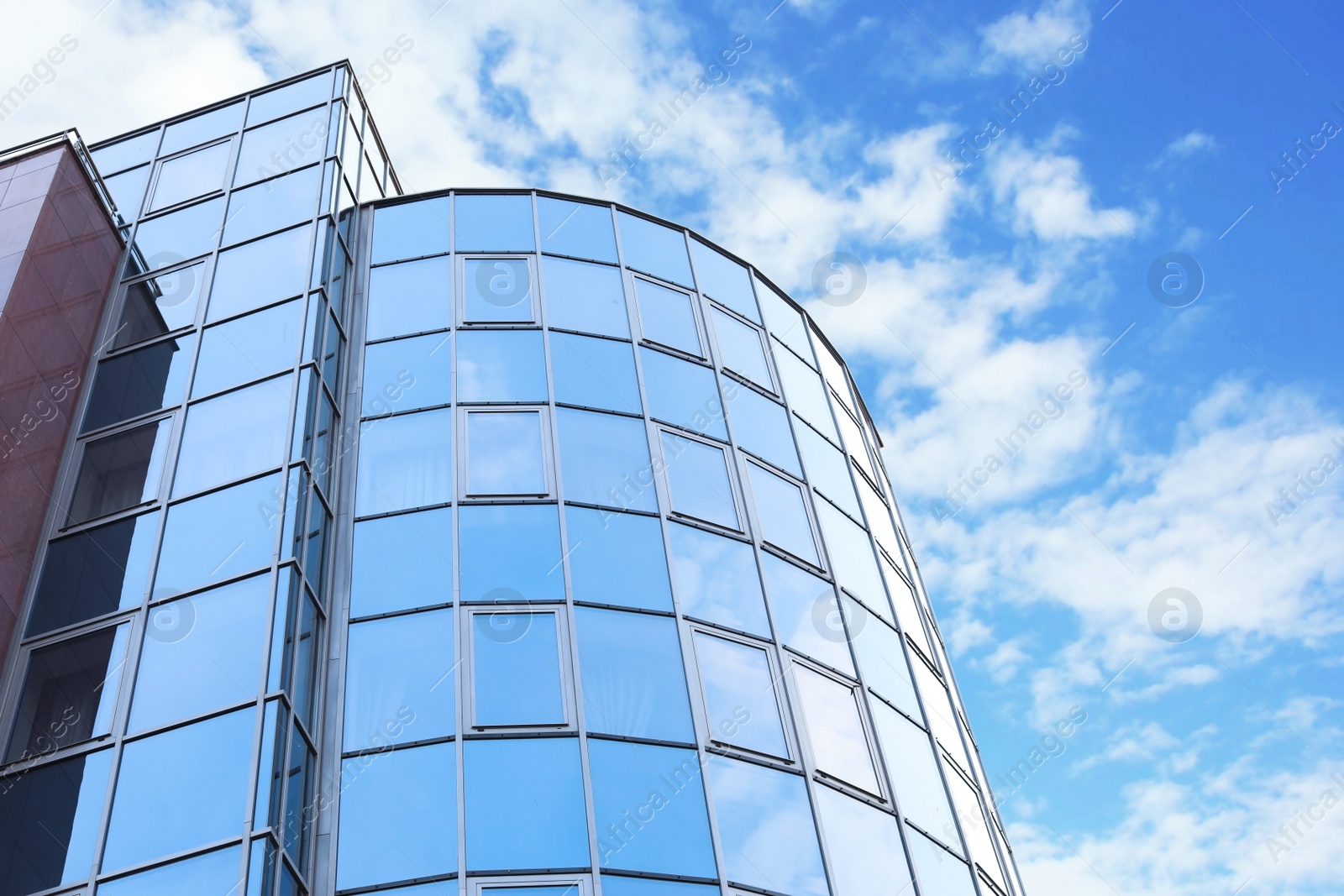 Photo of Building with tinted windows, outdoors. Modern architectural design