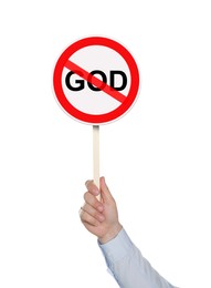Atheism concept. Man holding prohibition sign with crossed out word God on white background
