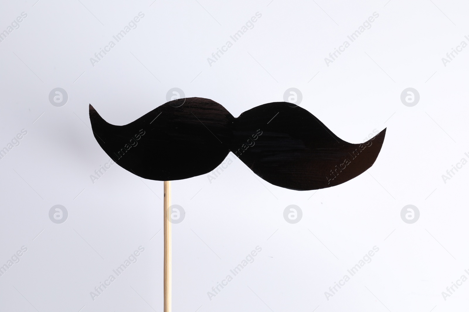 Photo of Fake paper mustache party prop against white background