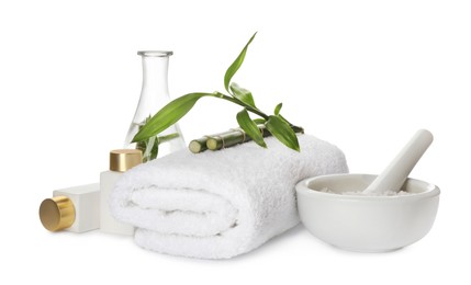 Photo of Composition with fresh bamboo, cosmetic products and towel on white background