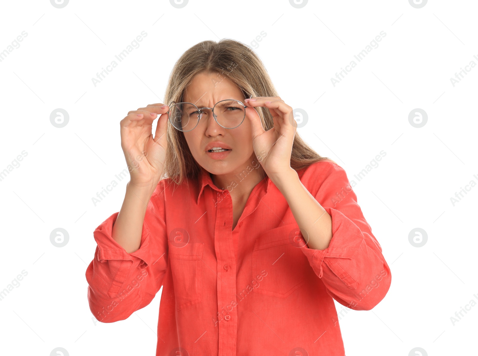 Photo of Young woman with vision problems wearing glasses on white background